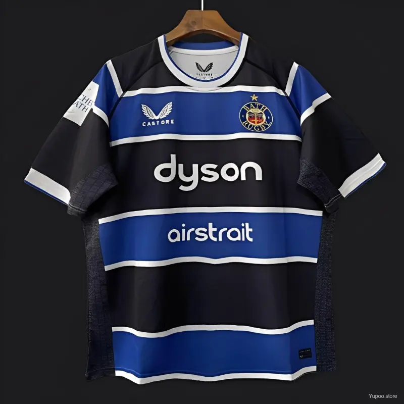 Maglia Bath Rugby 25/26 blu con cerchi bianchi e neri.
