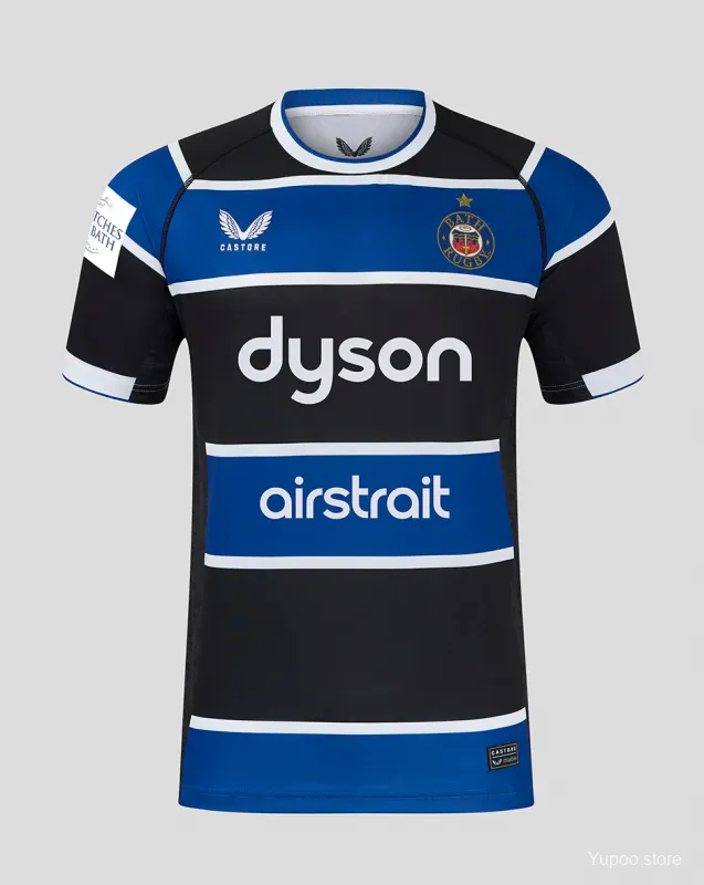 Maglia Bath Rugby 25/26 blu con cerchi bianchi e neri.