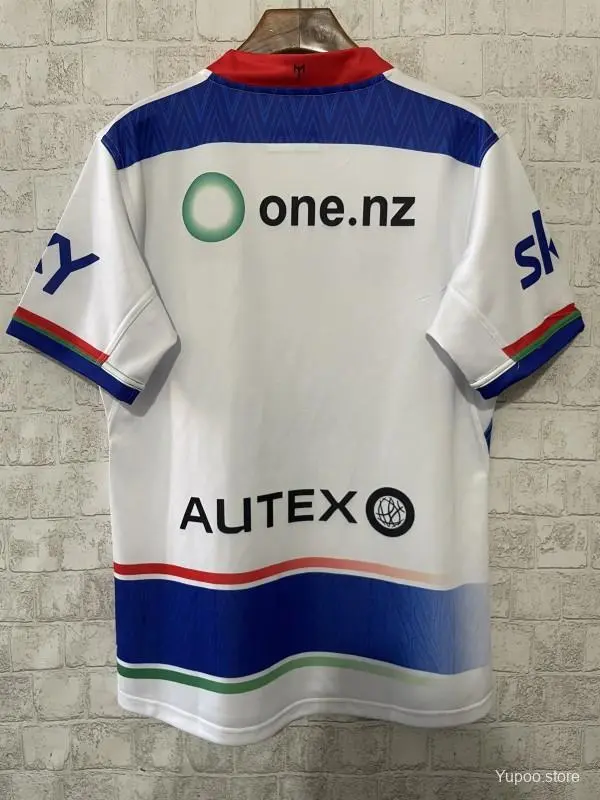 25/26 New Zealand Warriors Camiseta Heritage blanca con paneles azules y degradado circular