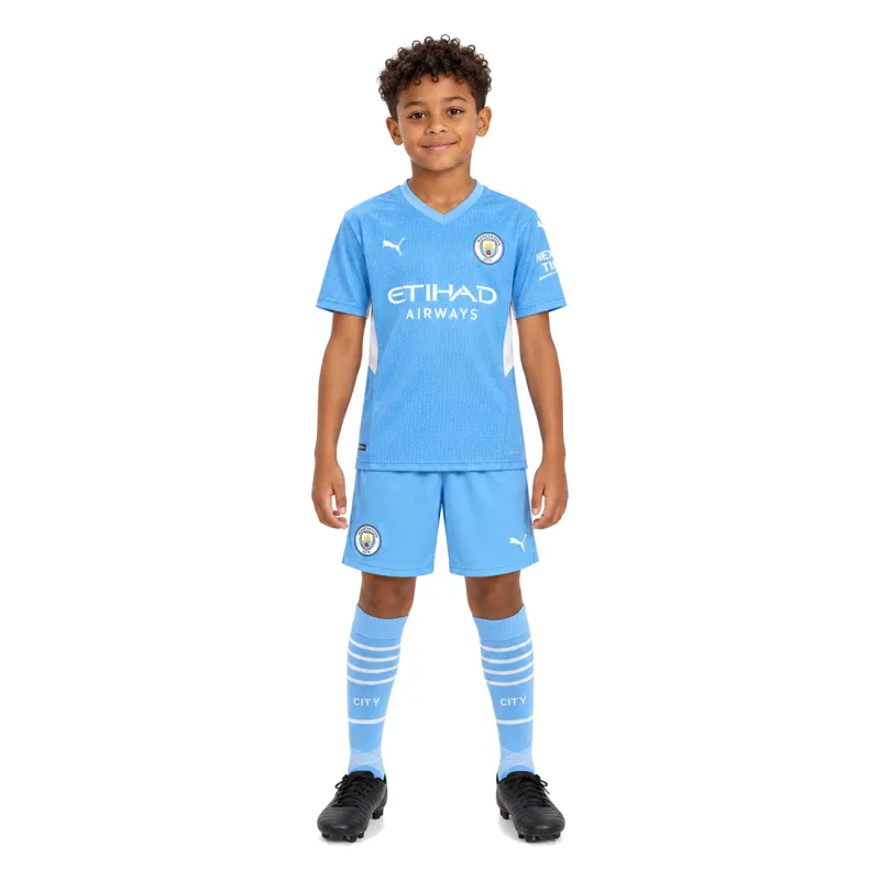 21/22 Manchester City Home Kids Kit — AI model preview, full-body front view; socks optional