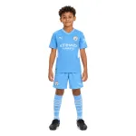 21/22 Manchester City Home Kids Kit — AI model preview, full-body front view; socks optional