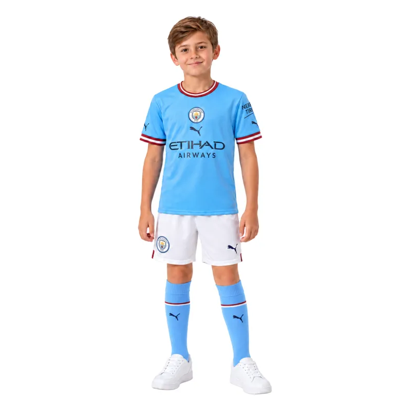 22/23 Manchester City Home Kids Kit — AI model preview, full-body front view; socks optional