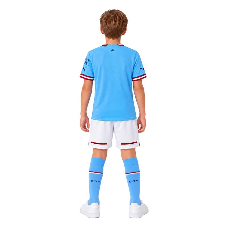 22/23 Manchester City Home Kids Kit — AI model preview, full-body back view; socks optional